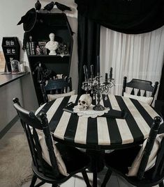 a black and white dining room table with skulls on it