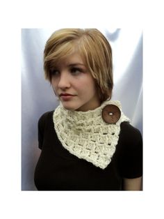 a woman wearing a crocheted cowl with a wooden button on her collar