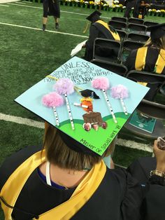 a person wearing a graduation cap with candy on it