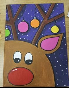 a painting of a reindeer with christmas ornaments on it's antlers and nose