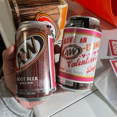 two cans of beer sitting next to each other