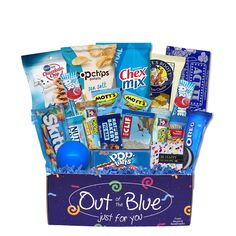 a blue box filled with lots of candy and snacks on top of a white background