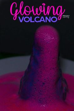 the cover of glowing volcano magazine, with pink and purple liquid pouring out of it