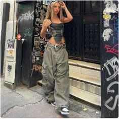 Join the fashion revolution with this Y2K Baggy Pants! Introducing our Y2K Baggy Pants in a stylish grey hue, the epitome of Y2K fashion. These wide-leg trousers feature a low waist and unique patchwork design, delivering a blend of streetwear, hip-hop, and grunge styles. Crafted for women who embrace fashion as a form of self-expression, these pants exude the spirit of the 2000s era while ensuring comfort and individuality. Elevate your fashion game with these Y2K Pants, and make a bold statement in the world of women's fashion. Material: Cotton Closure type: Button Fly Style: Streetwear and Y2K Free delivery 👖 Size (cm) 👖 Size Waist Hips Length S 66 119 105 M 70 123 107 L 74 127 109 Pakaian Hipster, Streetwear Girl, Christmas Outfits Women, Cargo Pants Outfit, Looks Street Style, Y2k Outfits, Streetwear Fashion Women, Autumn Fashion Casual, Baggy Pants