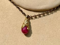 Genuine Ruby faceted gemstone set in a gold plated bail on a continuous 32" bronze chain.  Just slip it on and go.  This will instantly become your favorite accessory! Custom length upon request. Bohemian Yellow Gold Briolette Jewelry, Bohemian Gold Necklace With Faceted Details, Bohemian Gold Faceted Necklace, Beach Style Fashion, Pendant Minimalist, Elegant Necklace, Elegant Necklaces, Faceted Gemstones, Jewelry Gold