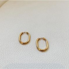 Minimal and simple gold oval hoop earrings. These earrings are made from stainless steel with 18k gold plated. The oval style hoops are unique in style yet dainty enough for everyday wear. They will certainly elevate your daily outfits with an effortless chic look. ………………………………….D E T A I L S• Materials: Stainless steel, 18k gold plating.• Earrings length: 0.8 inches (22 cm)• Earrings Width: 0.5 inches (15 mm)• This product is hypoallergenic, water and tarnish resistant Chic Gold Oval Hoop Earrings, Gold Oval Hoop Earrings Minimalist Style, Gold Oval Minimalist Hoop Earrings, Minimalist Gold Oval Hoop Earrings, Gold Minimalist Oval Hoop Earrings, Gold Plated Oval Huggie Earrings, Minimalist Gold Plated Oval Hoop Earrings, Minimalist Oval Everyday Earrings, Everyday Tarnish-resistant Oval Hoop Earrings