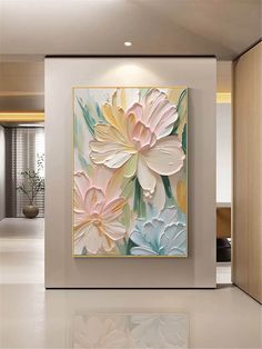 a painting on the wall with flowers in it