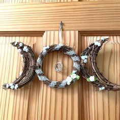 a close up of a wreath on a door with the word boo written in it