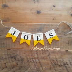 a yellow and white bunting banner that says toes