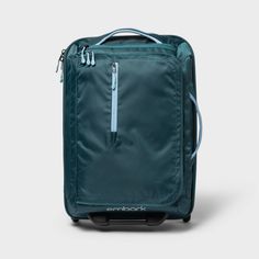 You'll never feel disorganized on vacation again when you pack your items into this 22.5" Softside Carry-On Suitcase from Embark™. The main compartment of this teal softside suitcase features both cross straps and a large zip pocket to help keep your things organized, and there's also an exterior zip pocket to give you extra space for storing small essentials. The interior is lined to help protect your items, while the main zipper closure keeps everything securely inside the suitcase. With a whe Best Carry On Bag For Women, Lightweight Carry On Luggage, Best Carry On Bag, Thailand Honeymoon, Lightweight Luggage, Best Travel Accessories, T Strap Flats, Travel Necessities, Best Carry On Luggage