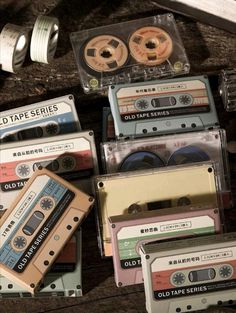 an assortment of old - fashioned tapes and tape recorders