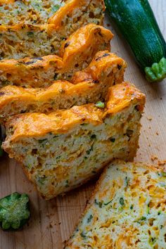 sliced zucchini bread on a cutting board next to broccoli