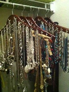 there are many necklaces hanging on the rack