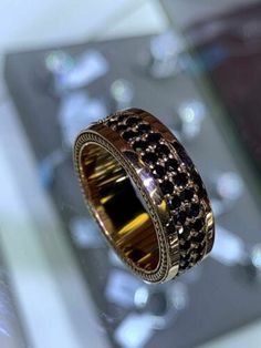 a gold and black diamond ring on display at a jewelery shop in london, england