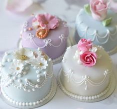 there are four cakes that have flowers on them