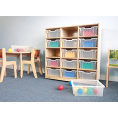 a child's play room with toys and storage bins