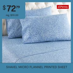 an image of a bed with blue sheets and pillows on it for $ 72 99