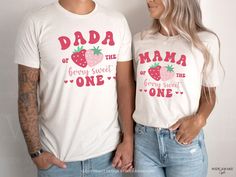 a man and woman standing next to each other wearing matching tshirts that read, mama of the berry sweet one