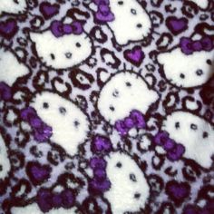 purple and white skulls with hearts on them are seen in this image, taken from above