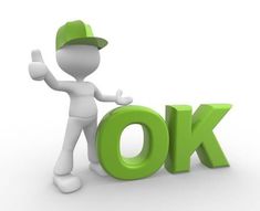 a person standing next to the word ok in green letters on white background stock photo