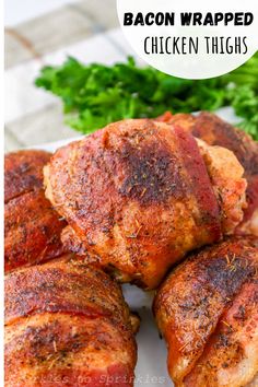 bacon wrapped chicken thighs on a white plate with parsley and parsley in the background