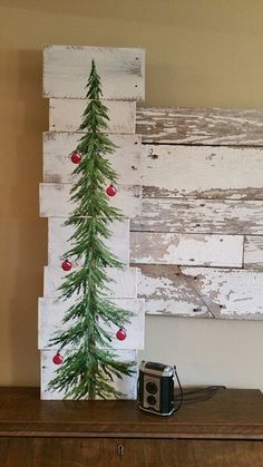 a christmas tree painted on top of a dresser