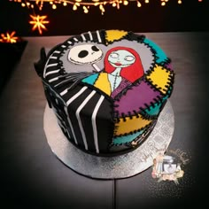 there is a cake decorated with the characters from the animated movie jack and sally on it