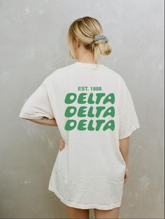 Soft, cute, and trendy, this Delta Delta Delta sorority t-shirt will quickly become your go-to cozy shirt! Use the drop down to specify preference between white, ivory, chambray, orchid, or blossom. LISTING IS FOR TRI DELTA. Please be sure you are ordering for your correct Sorority. We print on high quality, soft, & heavyweight materials, sustainably made and printed in the US. ♥ SIZING ♥ Unisex Sizing- For a more feminine, fitted look we recommend getting your size. For a more oversized look, w Oversized School Spirit T-shirt With Letter Print, White Sorority Graphic Print T-shirt, White Sorority Tops With Letter Print, Sorority Cotton T-shirt With Graphic Print, Sorority Crew Neck Top For Streetwear, White School Spirit T-shirt For Everyday, Pre-shrunk Sorority T-shirt With Crew Neck, White Crew Neck Sorority T-shirt, Pre-shrunk Crew Neck Sorority T-shirt