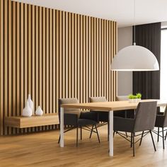 a dining room table and chairs in front of a wooden wall with vertical slats