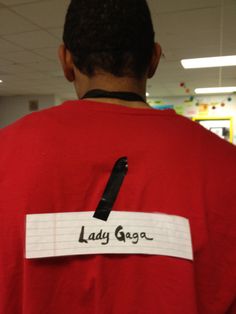 a man in a red shirt with a name tag on his back that says lady grace