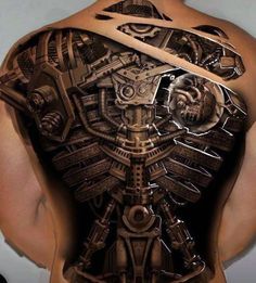 the back of a man's body with mechanical tattoos on it