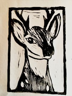 a black and white drawing of a deer's head in a square frame on paper