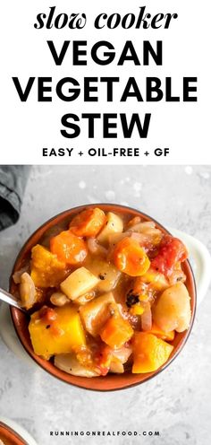 a bowl filled with vegetable stew next to a spoon