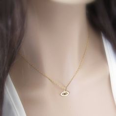 Evil Eye Necklace-Add Your Initial or Keep it Simple-Evil Eye Jewelry- Greek Lucky Evil Eye Pendant Necklace-Personalized Bridesmaid Gift A dainty and minimal evil eye necklace. Perfect for layering with other necklaces. Its shine and beauty will accentuate your feminine neckline and offer a little bit of luck at the same time! A must have for yourself or for a loved one that is need of a bit love luck and protection. THE perfect gift for your loved ones, bridesmaids, family and friends or most Flower Girl Jewelry, Wedding Bridesmaid Jewelry, Etsy Bridesmaid Gifts, Girl Jewelry, Hand Stamped Jewelry, Eye Pendant, Evil Eye Pendant, Childrens Jewelry, Evil Eye Necklace