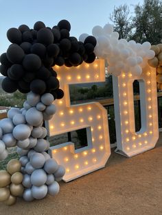 balloons are arranged in the shape of letters and numbers for a 50th birthday party or celebration