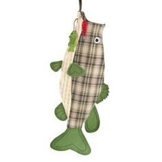 a fish ornament hanging from a hook on a white background with a plaid pattern