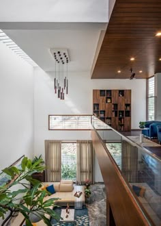 a living room filled with furniture and lots of windows