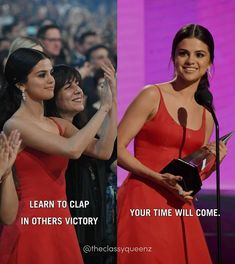 two women in red dresses standing next to each other with their hands up and one holding an award