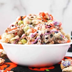 a white bowl filled with halloween salad on top of a table