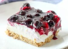 a piece of cheesecake with blueberries on top