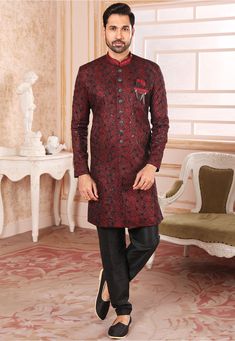 Art Silk Sherwani in Maroon This Readymade attire is Enhanced with Buttons, Brooch, Pocket, Resham and Sequins Work. Crafted in Chinese Collar Neck and Full Sleeve Available with an Art Dupion Silk Pant in Black Do note: Footwear shown in the image is for presentation purposes only. Brooch Design and Half to one inch in measurement may vary. (Slight variation in actual color vs. image is possible) Indo Western Sherwani, Mens Sherwani, Sherwani For Men, Ethnic Wedding, Indian Saree Blouse, Embroidered Art, Utsav Fashion, Groom Wear, Salwar Kameez Designs