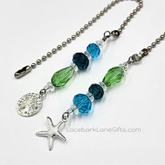 a starfish necklace with blue and green beads