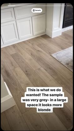 a kitchen with white cabinets and wood flooring that says, this is what we do wanted the sample was very grey in a large space if it looks more blonde