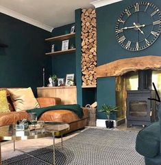 a living room filled with furniture and a large clock mounted to the wall above it