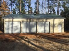 two garages in the middle of a wooded area