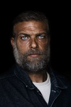 a man with a beard and blue eyes