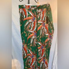 New With Tags Women’s Plus Size New Look Green Orange Yellow Floral, Botanical Print, 100% Rayon Pull On Wide Leg Pants With Elastic Waistband And A Fancy Drawstring. They Are A Size 3x But They Run Small So I Would Say It’s More Like A 2x Inseam Is 29 Inches Hips Are 28 Inches Across Laying Flat, Super Lightweight And Comfortable Gorgeous Colors. Perfect Dress Up Or Dress Down With A Jean Jacket Or Cute Tank Top. Green Tropical Print Pants For Vacation, Casual Green Pants With Tropical Print, Spring Green Tropical Bottoms, Tropical Wide Leg Green Pants, Green Relaxed Fit Pants With Floral Print, Green Floral Print Vacation Pants, Green Tropical Printed Bottoms, Green Floral Print Wide-leg Pants, Vacation Floral Print Wide-leg Pants