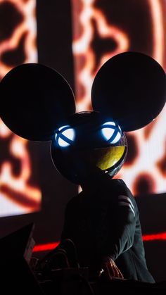 a mickey mouse with glowing eyes and ears