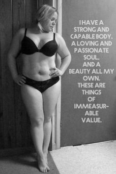 a woman in a bra and panties standing next to a sign that says i have a strong and capable body, a loving and passionate soul, and a beauty all my own