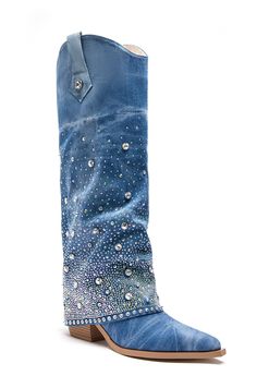 Shine like a star in these cowboy boots! The Mellow Western Denim Boot is an updated take on the classic cowboy boot. Features a light wash denim upper, a covered chunky heel, sparkling rhinestone gem embellishments, pointed toe shape, and rounded mid calf high shaft. Complete with a step in fit, pull on side tabs, and silver metallic accents. Perfect for a music festival, concert, or a night out! Mid calf height shaft Pointed toe Chunky heel Rhinestone detailing Denim Upper Step in fit 14” shaf Denim Cowboy Boots Outfit, Western Boots Outfit, Denim Rhinestone, Dressy Boots, Fold Over Boots, Shine Like A Star, Classic Cowboy, Bachelorette Outfits, Festival Concert